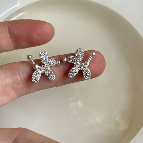 1 par de aretes de diamantes de imitación de cobre con incrustaciones de perro de estilo simple