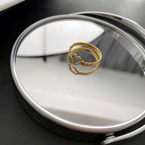 Anéis de chapeamento de aço de titânio em forma de coração estilo INS de 1 peça