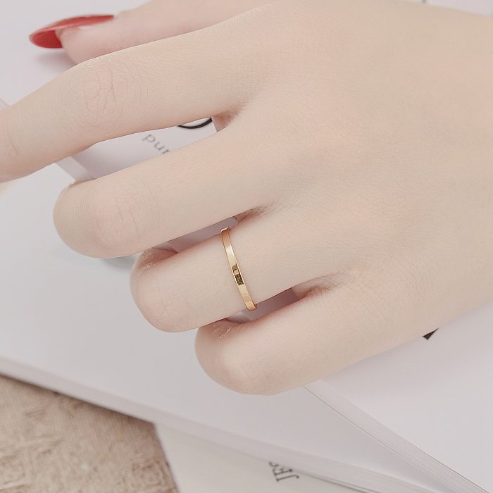 Venta al por mayor de joyería de anillo de acero de titanio liso simple de moda