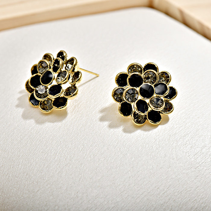 1 par de pendientes de diamantes de imitación de cobre con incrustaciones de flores de estilo Simple