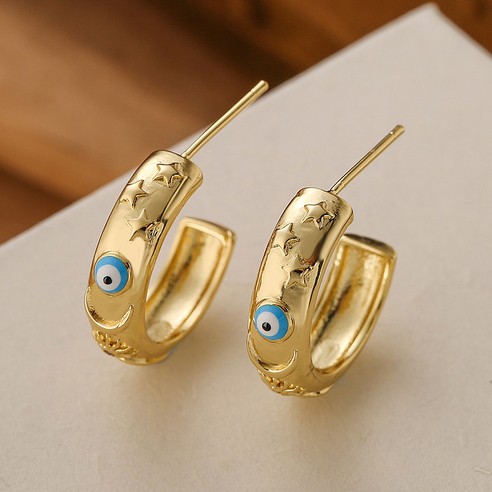 1 paire de clous d'oreilles plaqués or 18 carats, en forme d'oeil du diable, Style INS, en cuivre et émail