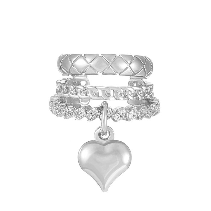 Pendientes de diamantes artificiales chapados en cobre con forma de corazón cruzado a la moda, 1 par