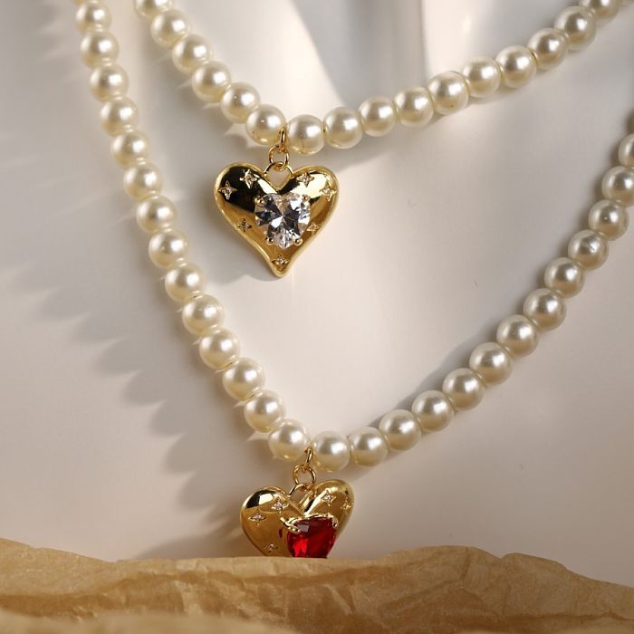 Collar con colgante chapado en oro de 18 quilates con incrustaciones de cobre y perlas de imitación en forma de sobre de viaje dulce