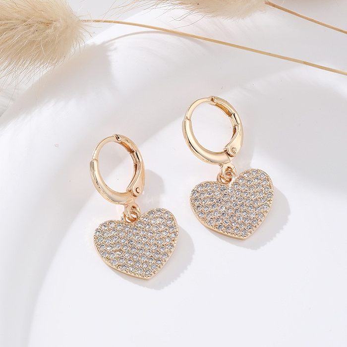 1 paire de boucles d'oreilles en forme de cœur, incrustation de cuivre et de Zircon plaqué or