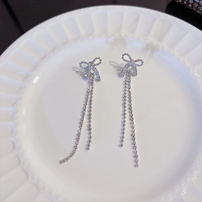 1 Paar schlichte Ohrringe mit Schleife und Knoten-Inlay aus Kupfer und Zirkon
