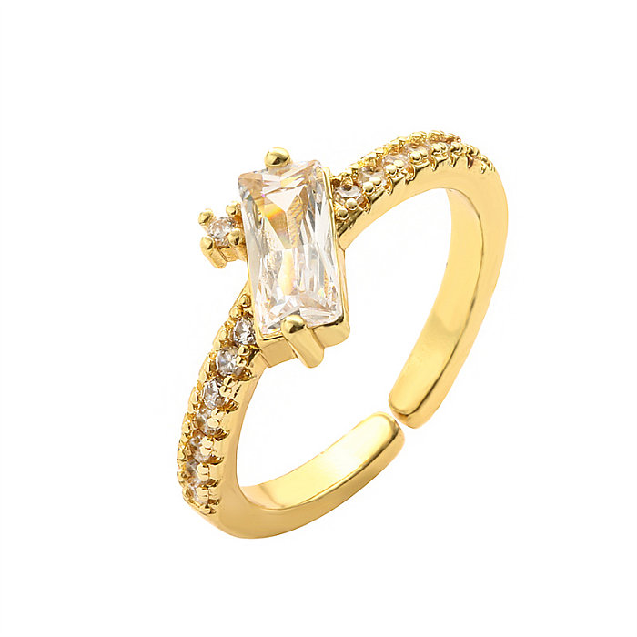 Lässiger, glänzender, wassertropfenförmiger, rechteckiger, offener Ring mit Inlay aus Zirkon und vergoldetem Zirkon