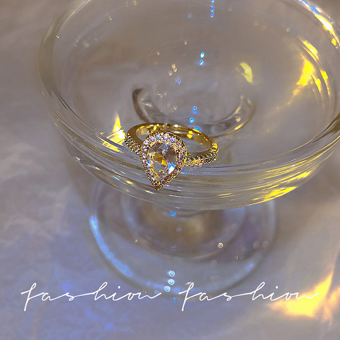 Moda Gotas de agua Forma de corazón Nudo de arco Incrustación de cobre Perlas artificiales Anillos de circón