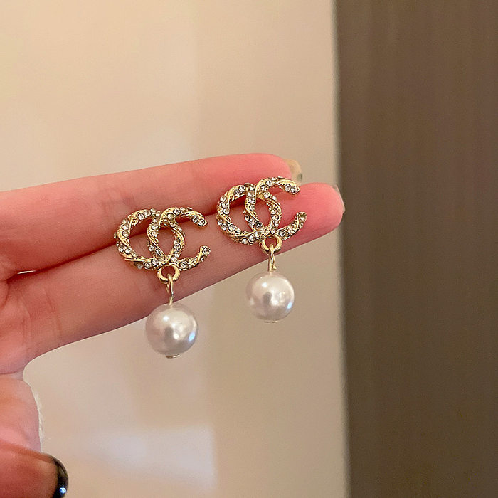 1 Pair Elegant Letter Bow Knot Inlay Metal Copper Pearl Zircon Drop Earrings