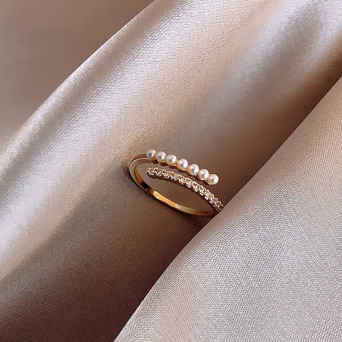 Moda Gotas de agua Forma de corazón Nudo de arco Incrustación de cobre Perlas artificiales Anillos de circón
