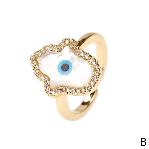 Anillo de concha creativo de cobre con circonita de ojo del diablo a la moda europea y americana, joyería al por mayor