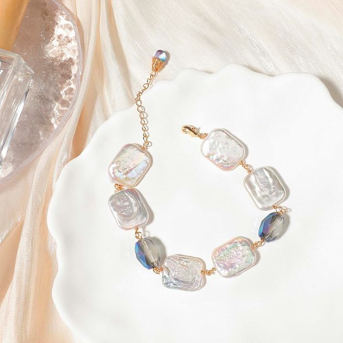 Glamouröse, unregelmäßige Halskette mit vergoldeten Armbändern aus Edelstahl mit Süßwasserperlenbeschichtung