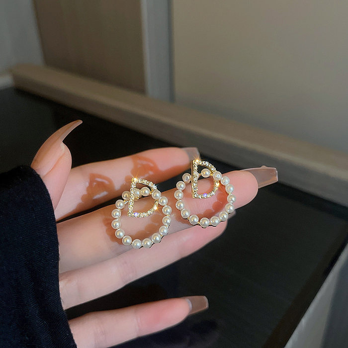 1 par casual elegante estilo simples geométrico formato de coração flor chapeamento incrustação de cobre brincos de strass artificiais