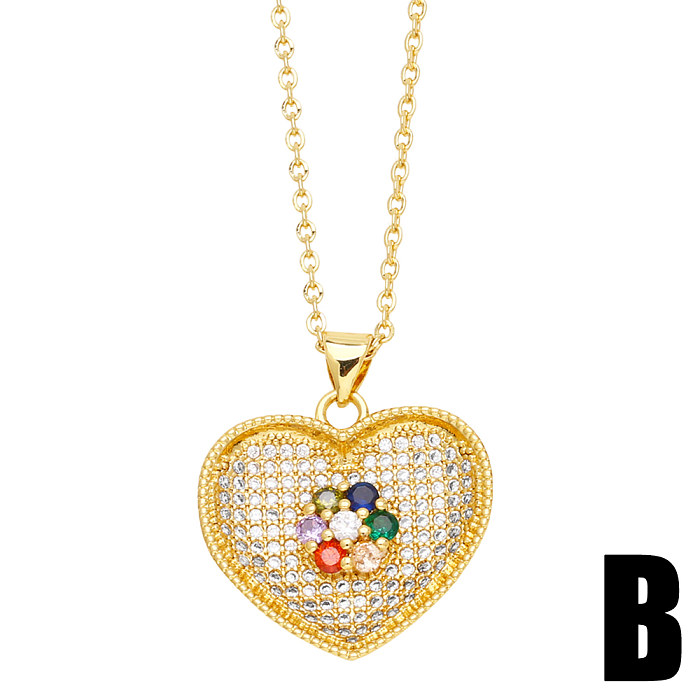 Collier pendentif élégant en forme de cœur en acier inoxydable avec incrustation de cuivre et de perles en zircon plaqué or 18 carats