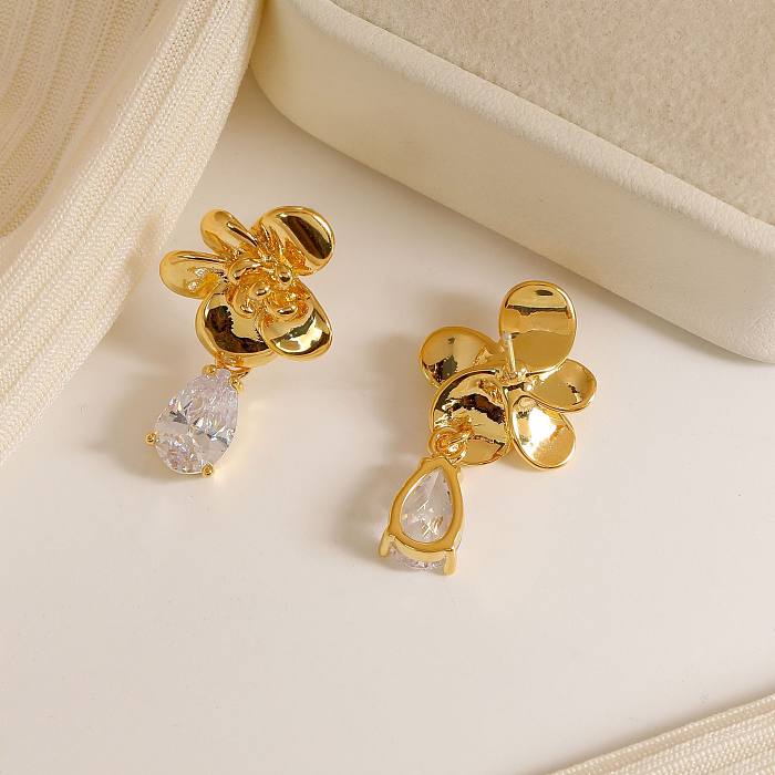 1 paire de boucles d'oreilles pendantes plaquées or 18 carats avec incrustation de placage géométrique de style moderne en cuivre et zircon