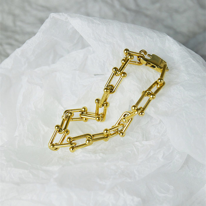 Pulseras chapadas en oro con revestimiento de acero de titanio en forma de U de estilo simple de hip-hop