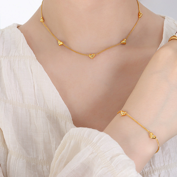 Elegante estilo simple en forma de corazón con incrustaciones de acero de titanio y circonita chapada en oro de 18 quilates, pulseras, pendientes y collar