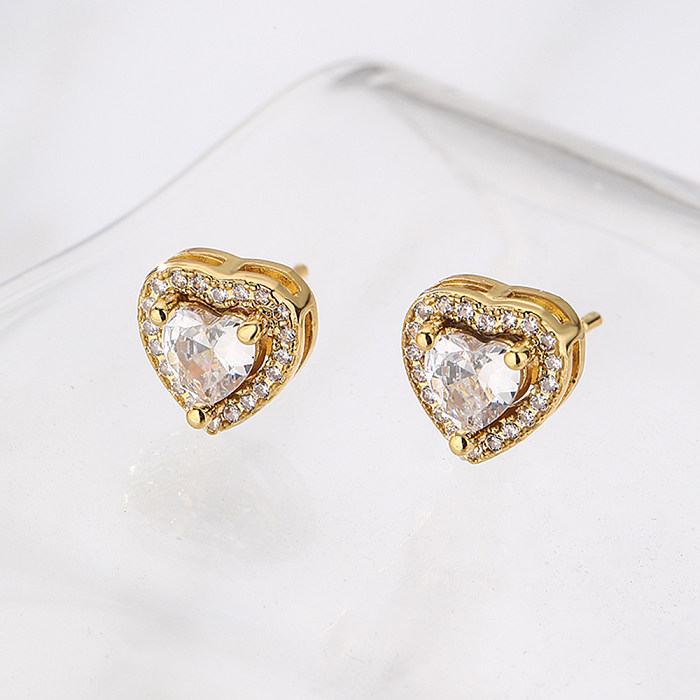 Brincos de orelha de cobre em formato de coração da moda com zircão banhado a ouro