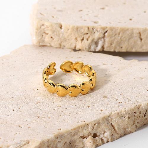 Anillo de acero de titanio de celebridades de Internet europeas y americanas Chapado al vacío Anillo abierto de gorro de amor tridimensional de acero inoxidable en oro de 18 quilates para mujeres