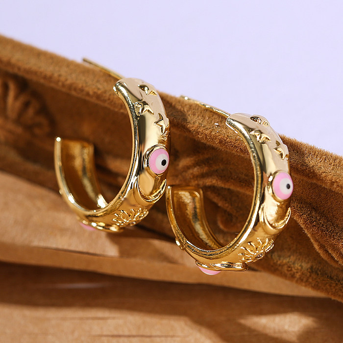 1 paire de clous d'oreilles plaqués or 18 carats, en forme d'oeil du diable, Style INS, en cuivre et émail
