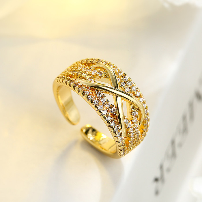 O estilo simples comuta anéis abertos geométricos do zircão 18K do embutimento do chapeamento de cobre banhados a ouro