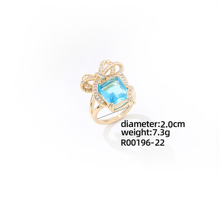 Luxuriöse Schleifenknoten-Kupferbeschichtung mit Zirkon-Inlay und vergoldeten Ringen