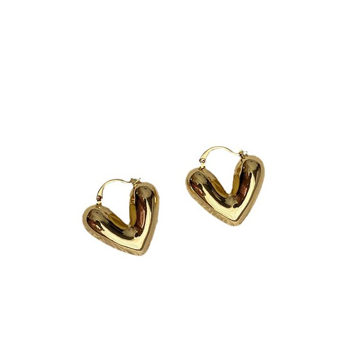 1 paire de boucles d'oreilles en cuivre plaqué en forme de cœur, style simple