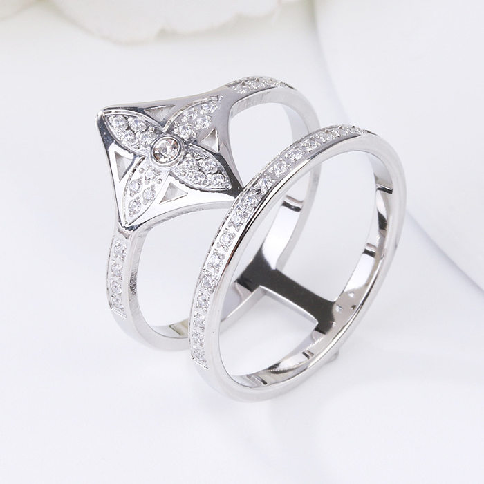 As pedras preciosas artificiais de aço Titanium da cor sólida do estilo simples abrem o anel no volume