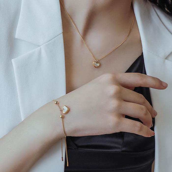 Collar chapado en oro de los pendientes de las pulseras del remiendo del acero del titanio de la forma del corazón del estilo simple