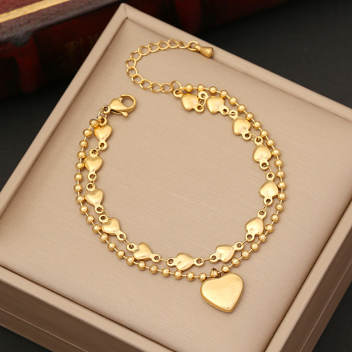 Collar de pendientes de pulseras de circón con incrustaciones de chapado de perlas de acero inoxidable en forma de corazón de moda