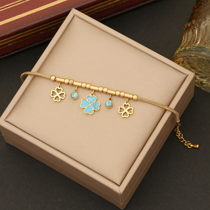 Collier de boucles d'oreilles de bracelets turquoise d'incrustation de placage d'acier inoxydable de fleur élégante