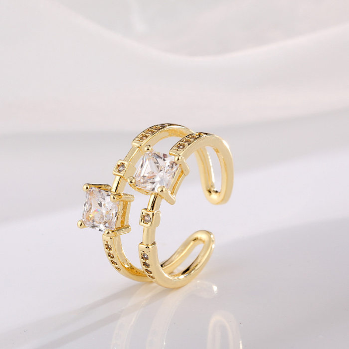 Offener Ring im klassischen Stil mit geometrischer Kupferbeschichtung und Zirkoneinlage, 18 Karat vergoldet