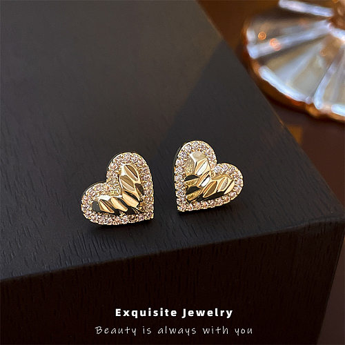 1 paire de clous d'oreilles en Zircon incrustés de cuivre en forme de cœur à la mode