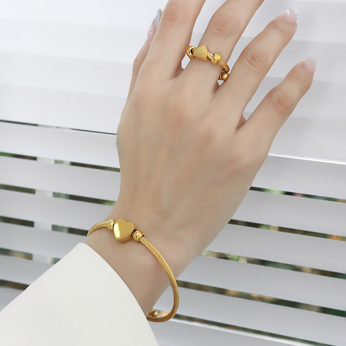 Pulseras plateadas oro titanio de los anillos del acero 18K de la forma elegante al por mayor del corazón