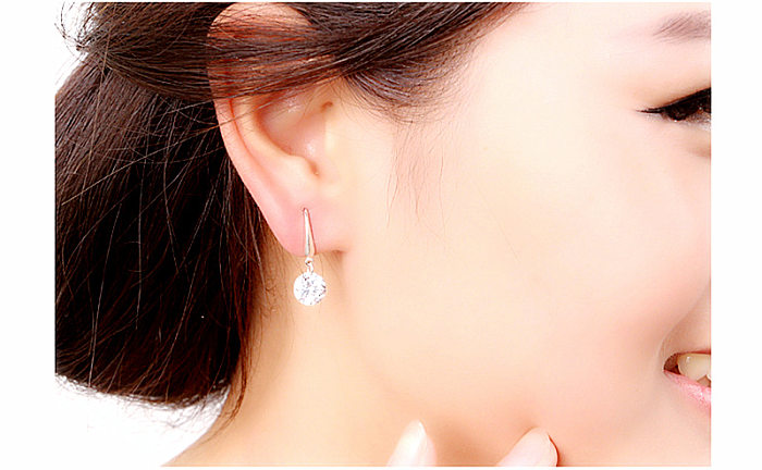 1 paire de boucles d'oreilles décontractées en placage rond brillant, incrustation de cristal de cuivre et de Zircon