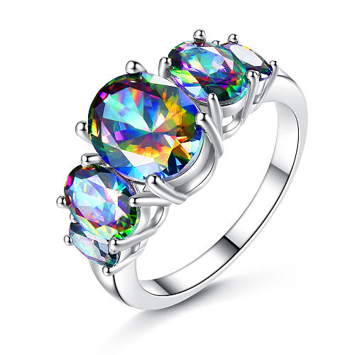 Elegantes anillos de circón con incrustaciones de cobre ovalados brillantes