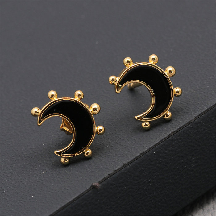 1 paire de clous d'oreilles élégants avec incrustation de lune en cuivre plaqué or