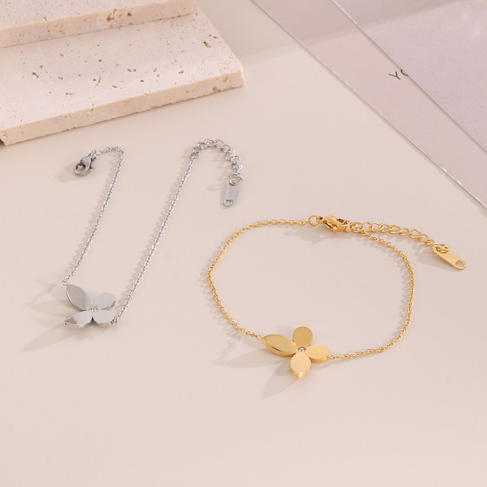 Doce estilo simples trevo de quatro folhas titânio chapeamento de aço incrustação diamante artificial 18k banhado a ouro pulseiras colar