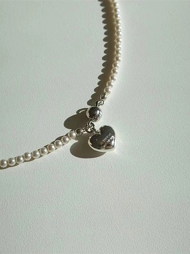 Elegante collar con colgante de perlas de imitación en forma de corazón para mujer