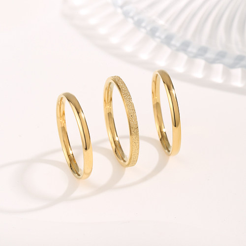 Schlichter Stil, klassischer Stil, einfarbig, Titanstahl-Beschichtung, vergoldete Ringe