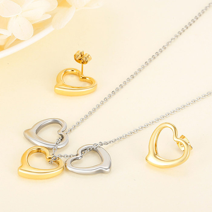 Nuevo conjunto de joyas de pendientes y collar de corazón de melocotón en forma de corazón de acero inoxidable europeo y americano