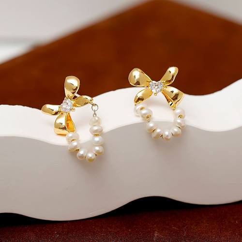 1 paire de boucles d'oreilles plaquées or 18 carats, Style Simple et doux, incrustation de nœud papillon, perle d'eau douce, cuivre et Zircon