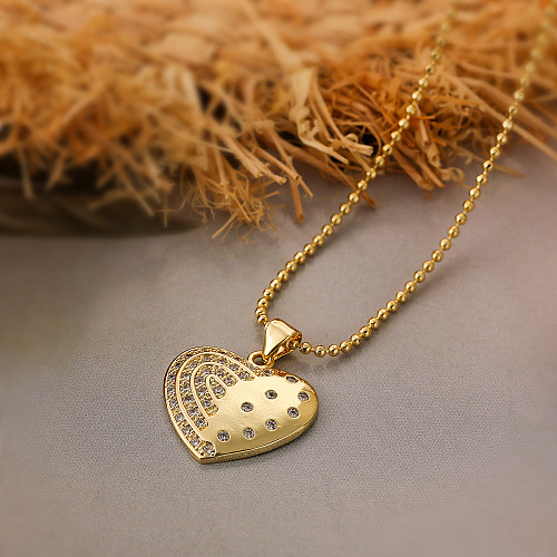 Collier pendentif plaqué or 18 carats avec incrustation de cuivre en forme de cœur de transport de style simple