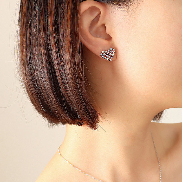 Boucles d'oreilles collier en forme de coeur plaqué or en acier titane simple à la mode