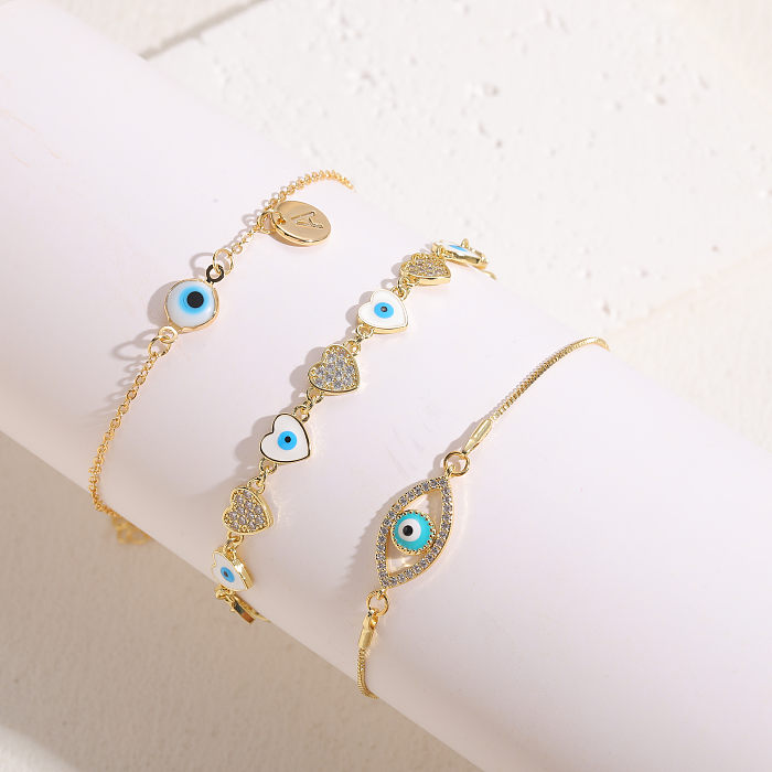 Elegante, luxuriöse, klassische Herzform-Augen-Kupfer-Emaille-Überzug-Inlay-Zirkon-Armbänder mit 14-Karat-Vergoldung