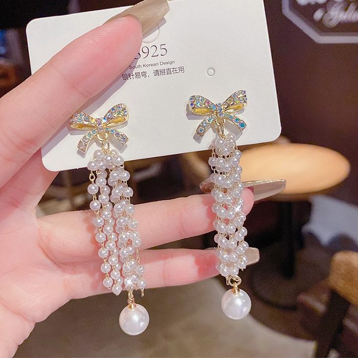 Pendientes colgantes de circonita con incrustaciones de cobre y perlas artificiales, nudo de lazo de mariposa y flor a la moda, 1 par