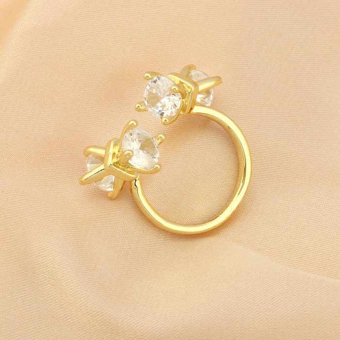 Elegante offene Ringe mit Schleifenknoten, Kupferbeschichtung und Zirkoneinlage, 18 Karat vergoldet