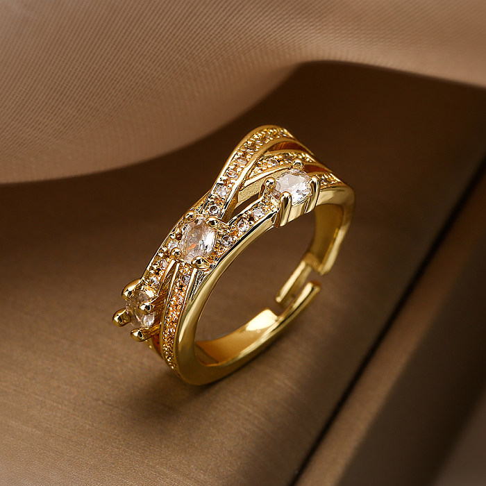 O estilo simples comuta anéis abertos redondos banhados a ouro do zircão 18K do embutimento do chapeamento de cobre