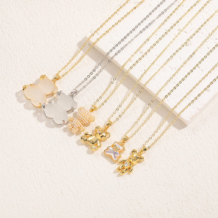 Elegante estilo clásico oso cobre 14K chapado en oro diamantes de imitación artificiales perlas artificiales colgante collar a granel