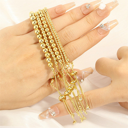 Bracelets plaqués or 18 carats avec incrustation de perles de cuivre rondes de style simple rétro