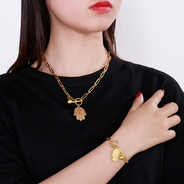 Conjunto de dos piezas de collar de pulsera de adorno en forma de palma de acero inoxidable simple de moda